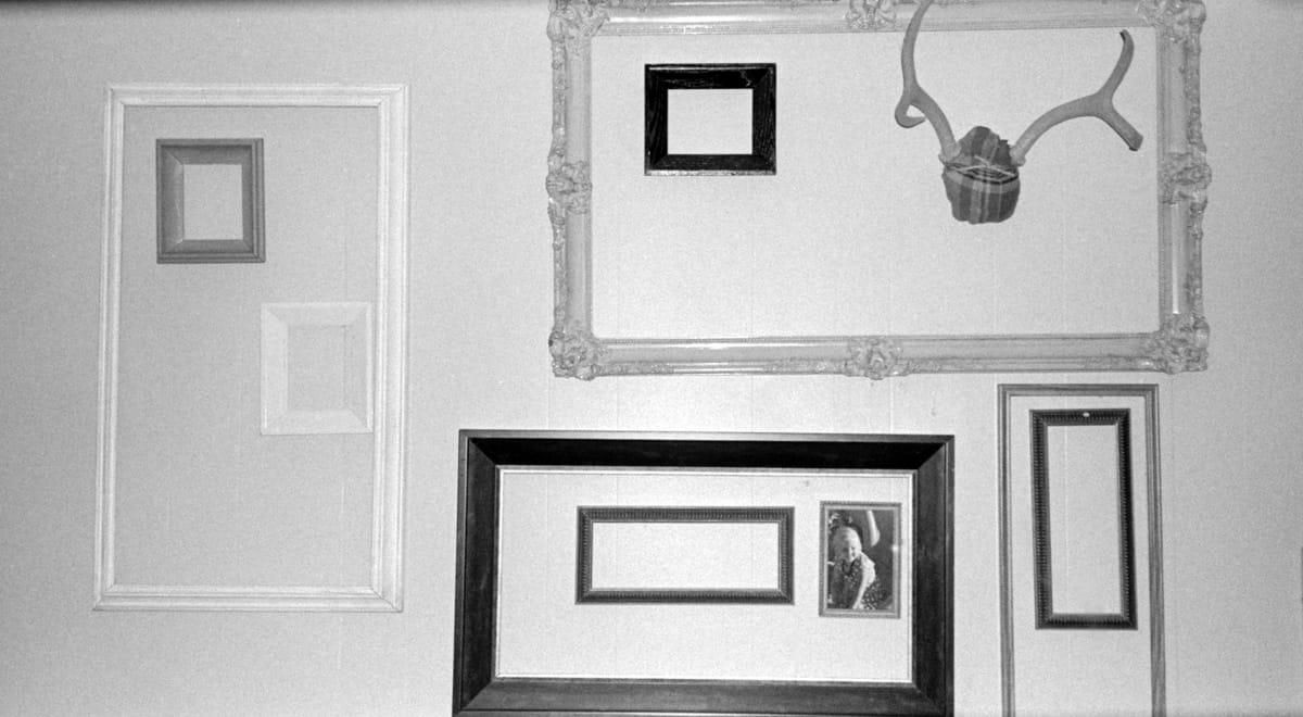 Odd picture frames on wall