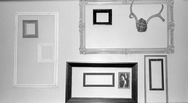 Odd picture frames on wall