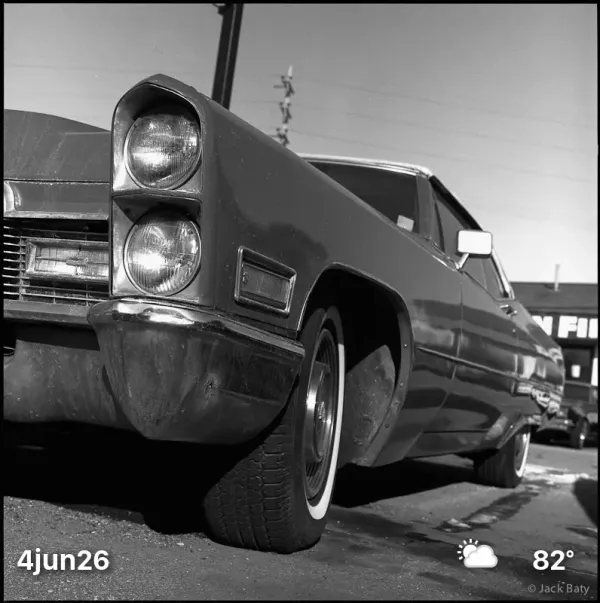 Black and white photo of old car